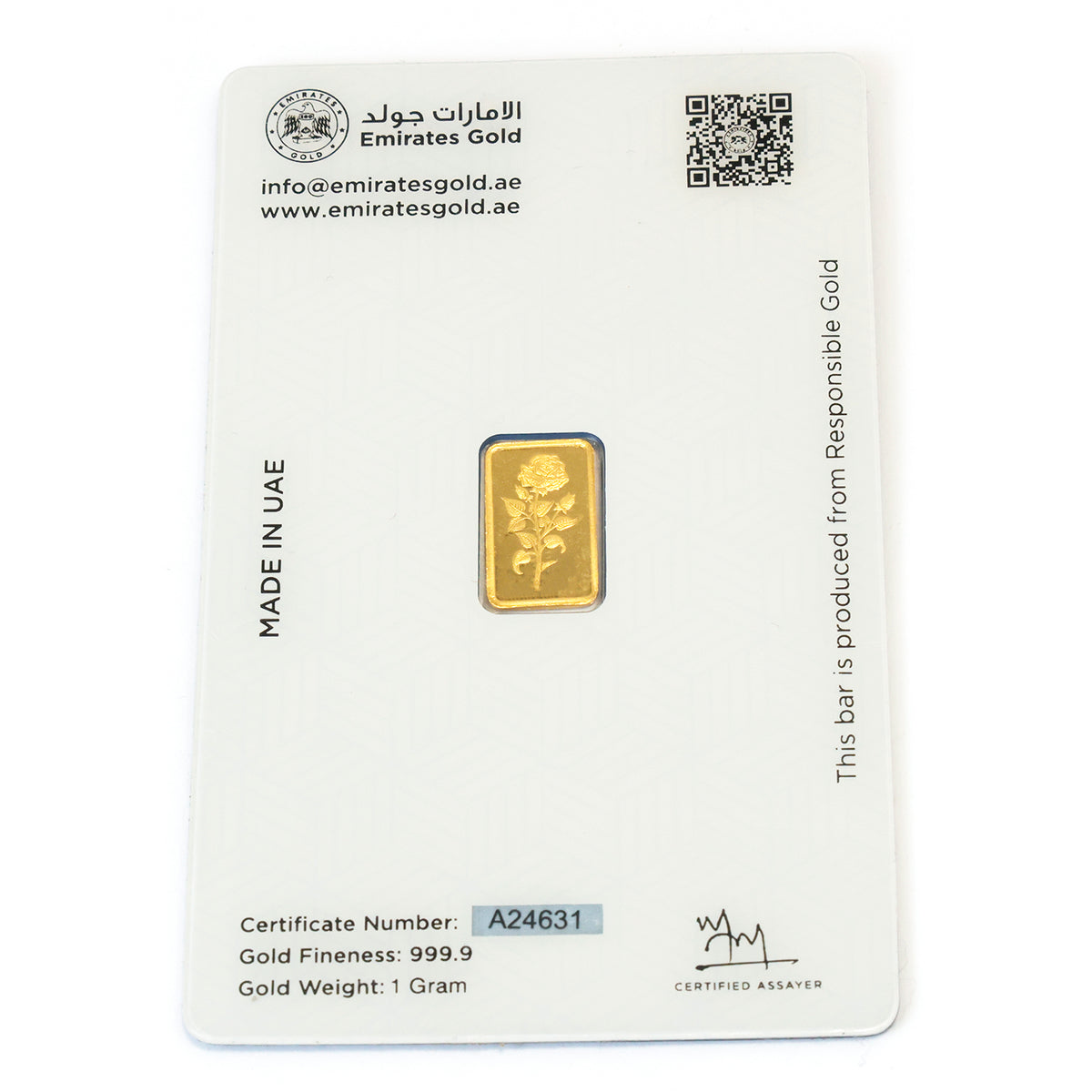 Gold bar on a Emirates Gold branded card with certification details.