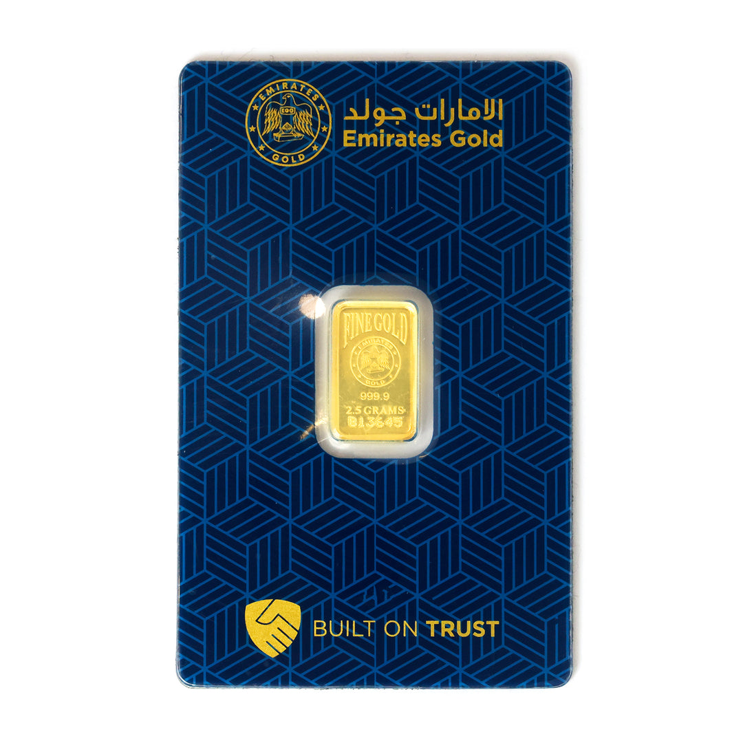 Gold bar in protective casing on a blue Emirates Gold branded card