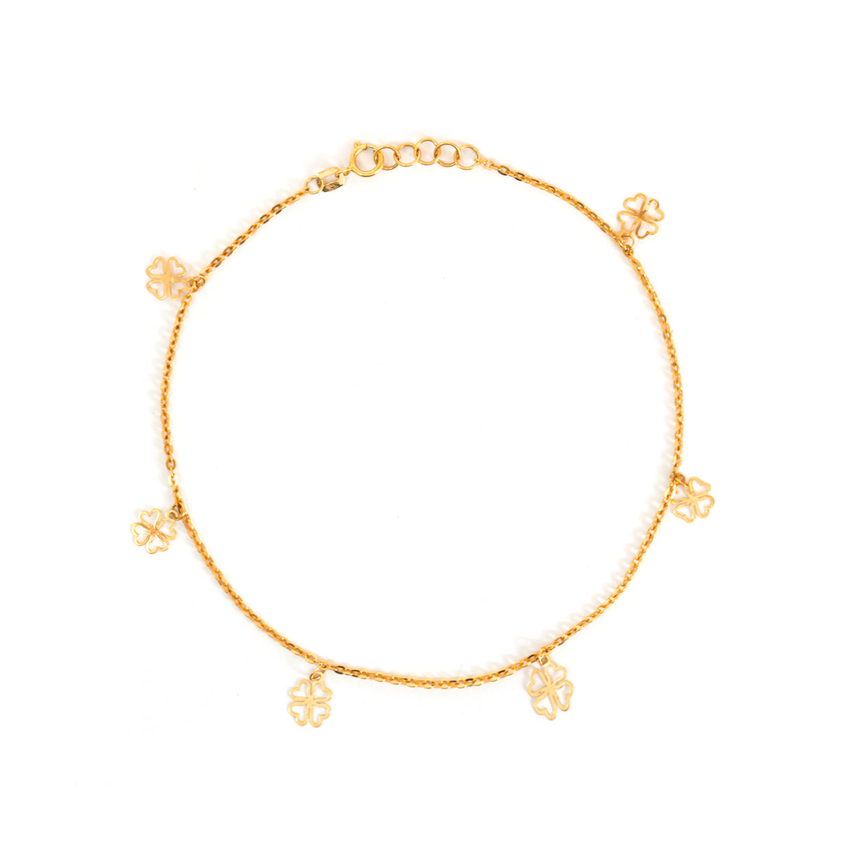 Gold anklet with floral charms on a white background