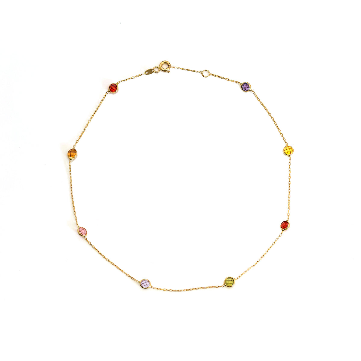 Gold bracelet with colorful beads on a white background