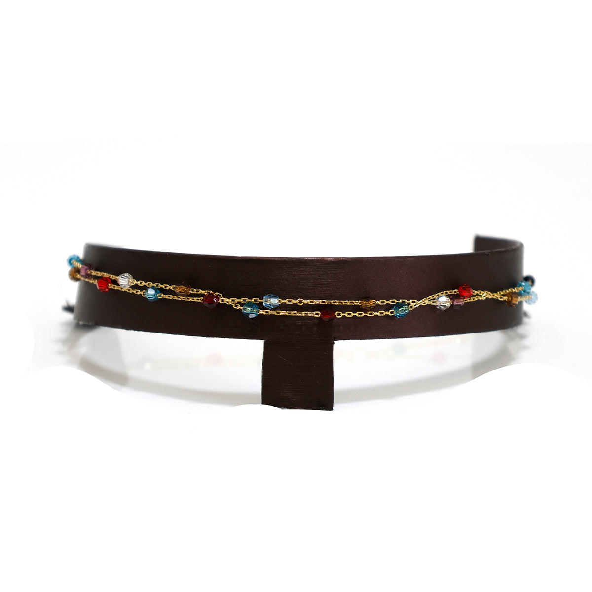 Brown leather belt with gold chain and colorful beads on a white background