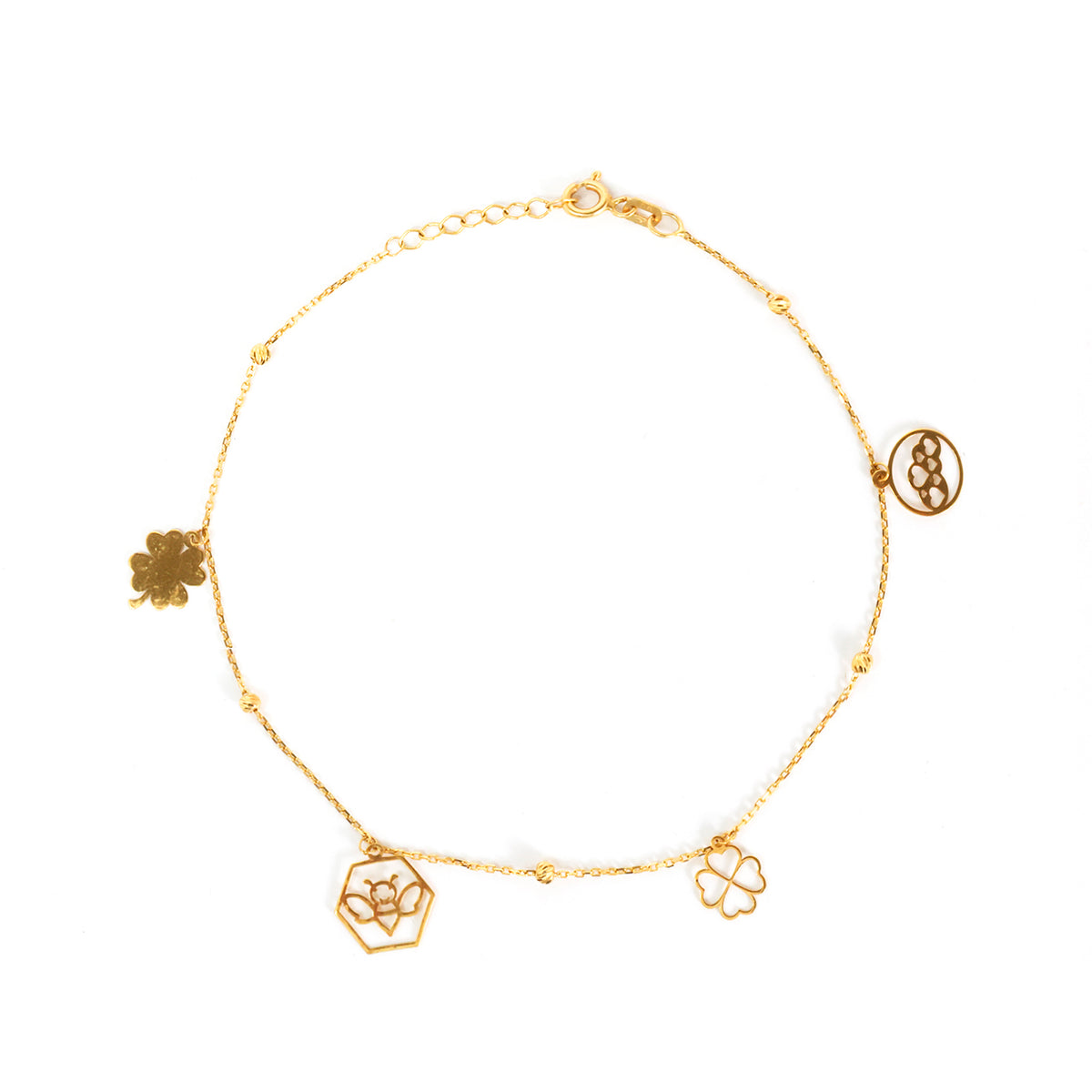 Gold bracelet with floral charms on a white background