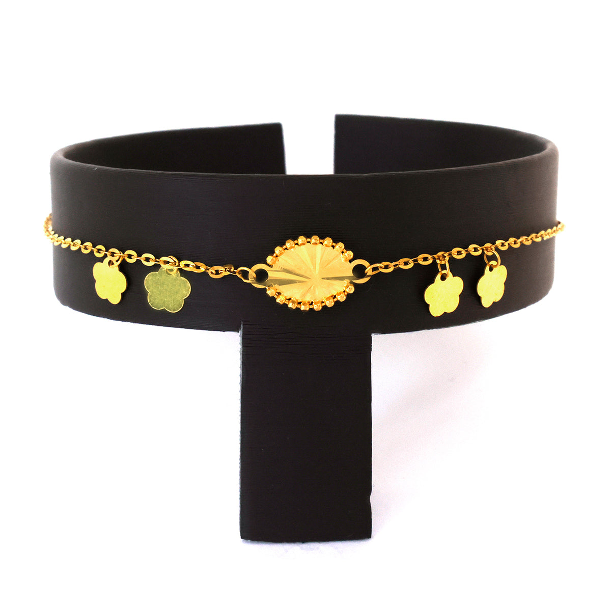 Black belt with gold chain and floral pendants on a white background
