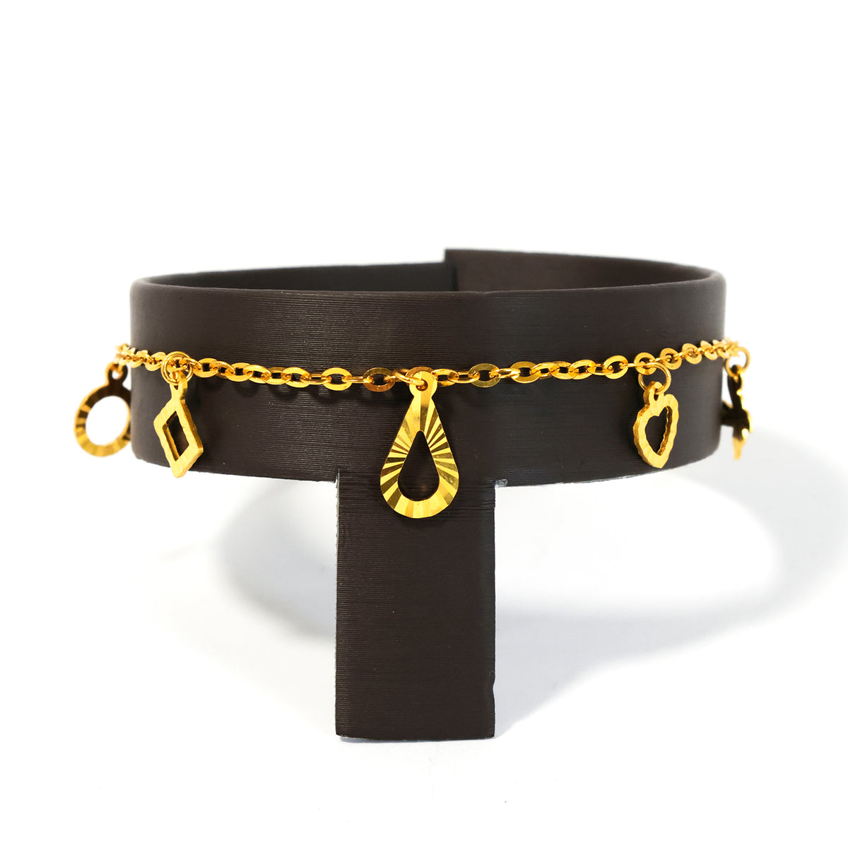 Black leather belt with gold chain and heart-shaped charms on a white background