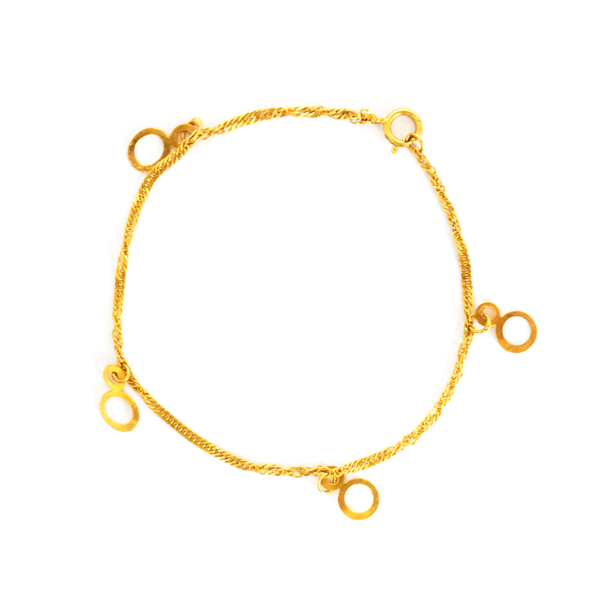 Gold bracelet with circular ends on a white background
