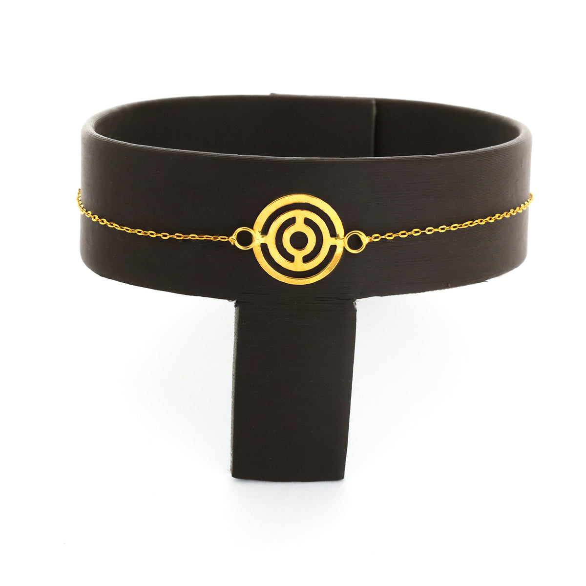 Black headband with gold circular design and chain on a white background