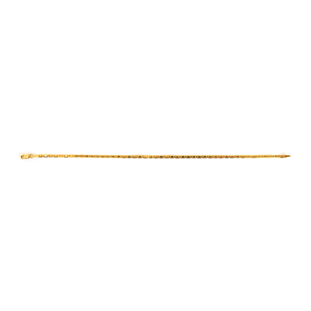 Gold-colored metal rod on a white background