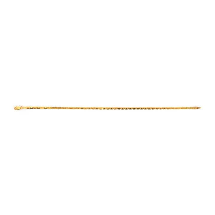 Gold-colored metal rod on a white background