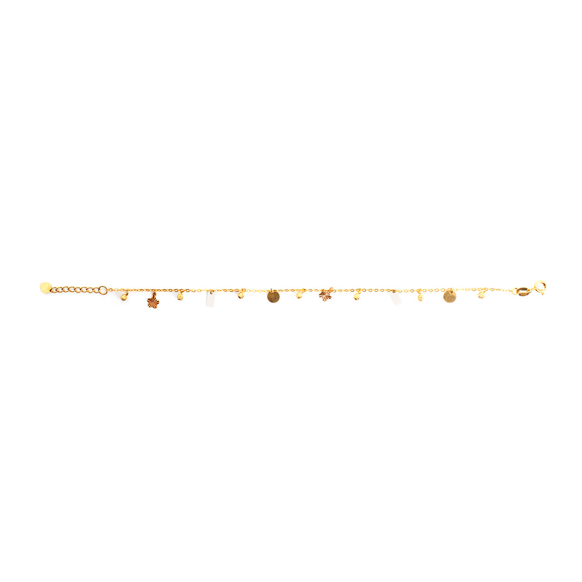 Gold anklet with various charms on a white background