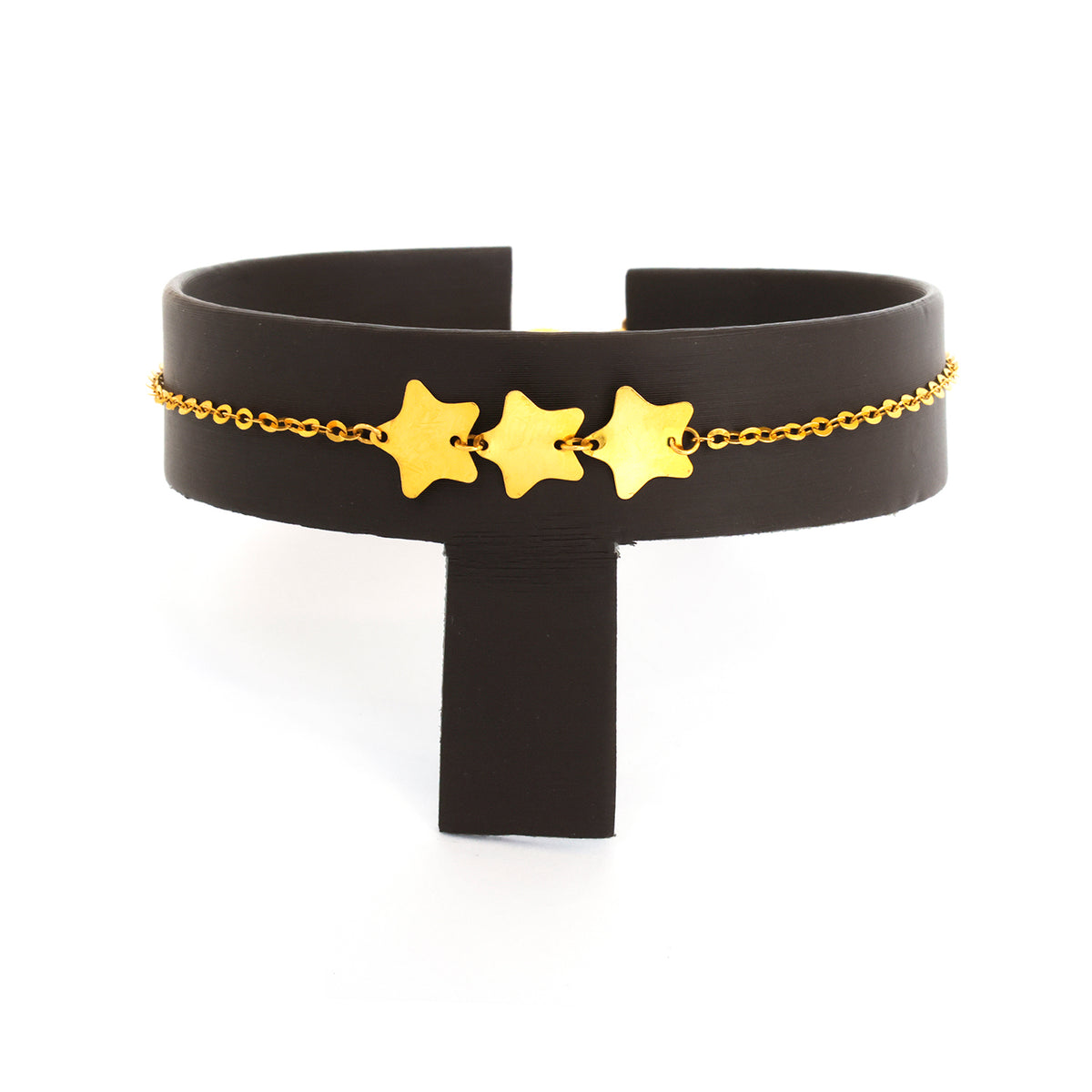 Black choker with gold chain and stars on a white background