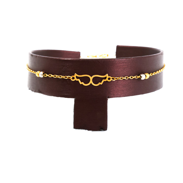 Brown leather choker with gold chain and decorative elements on a white background