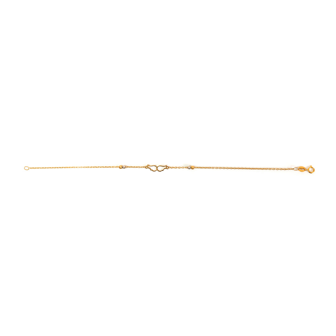 Gold anklet on a white background
