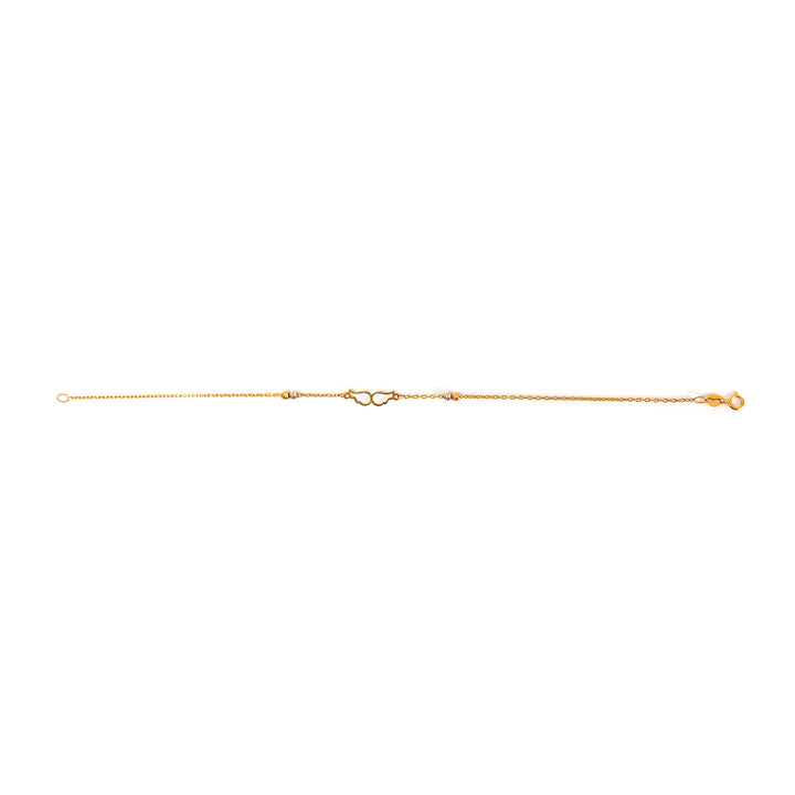 Gold anklet on a white background