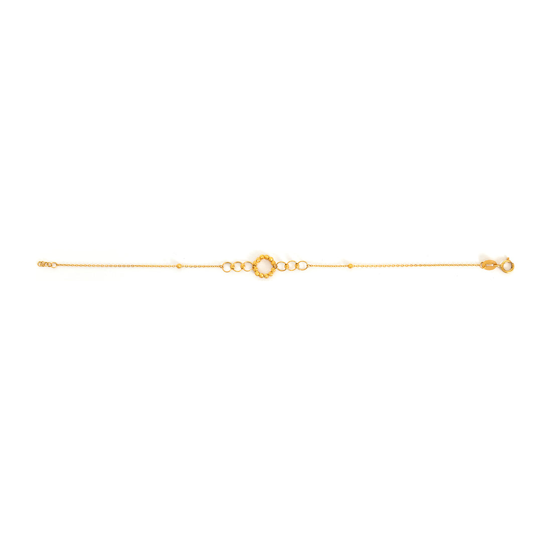 Gold bracelet on a white background