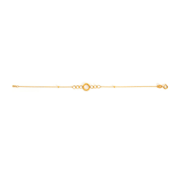Gold bracelet on a white background