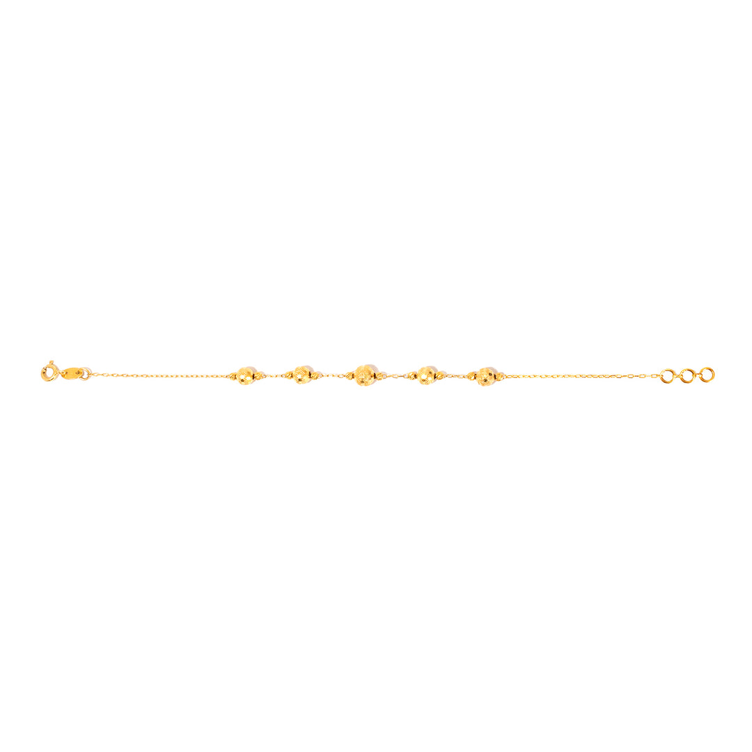 Gold anklet on a white background