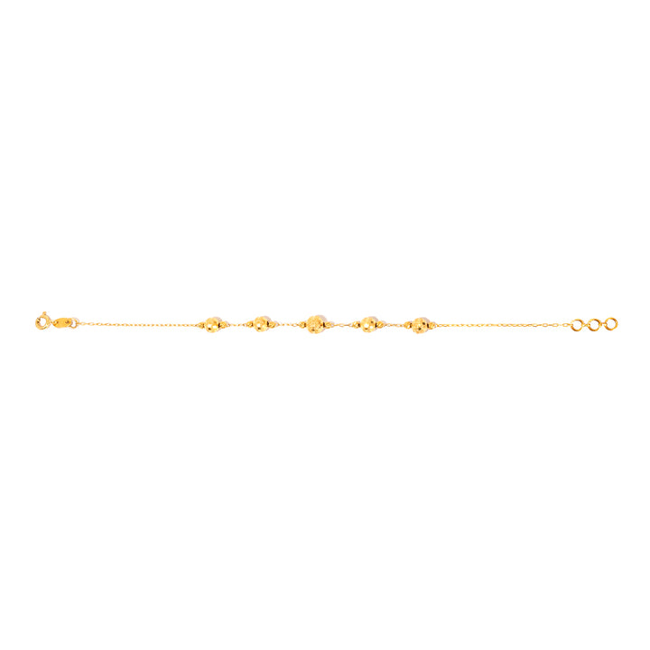 Gold anklet on a white background