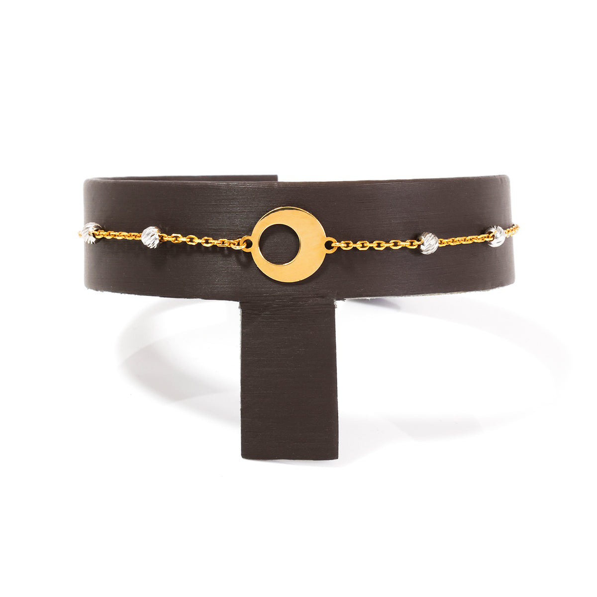 Black belt with gold chain and circular buckle on a white background