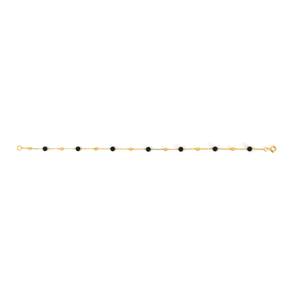 Gold bracelet with black beads on a white background