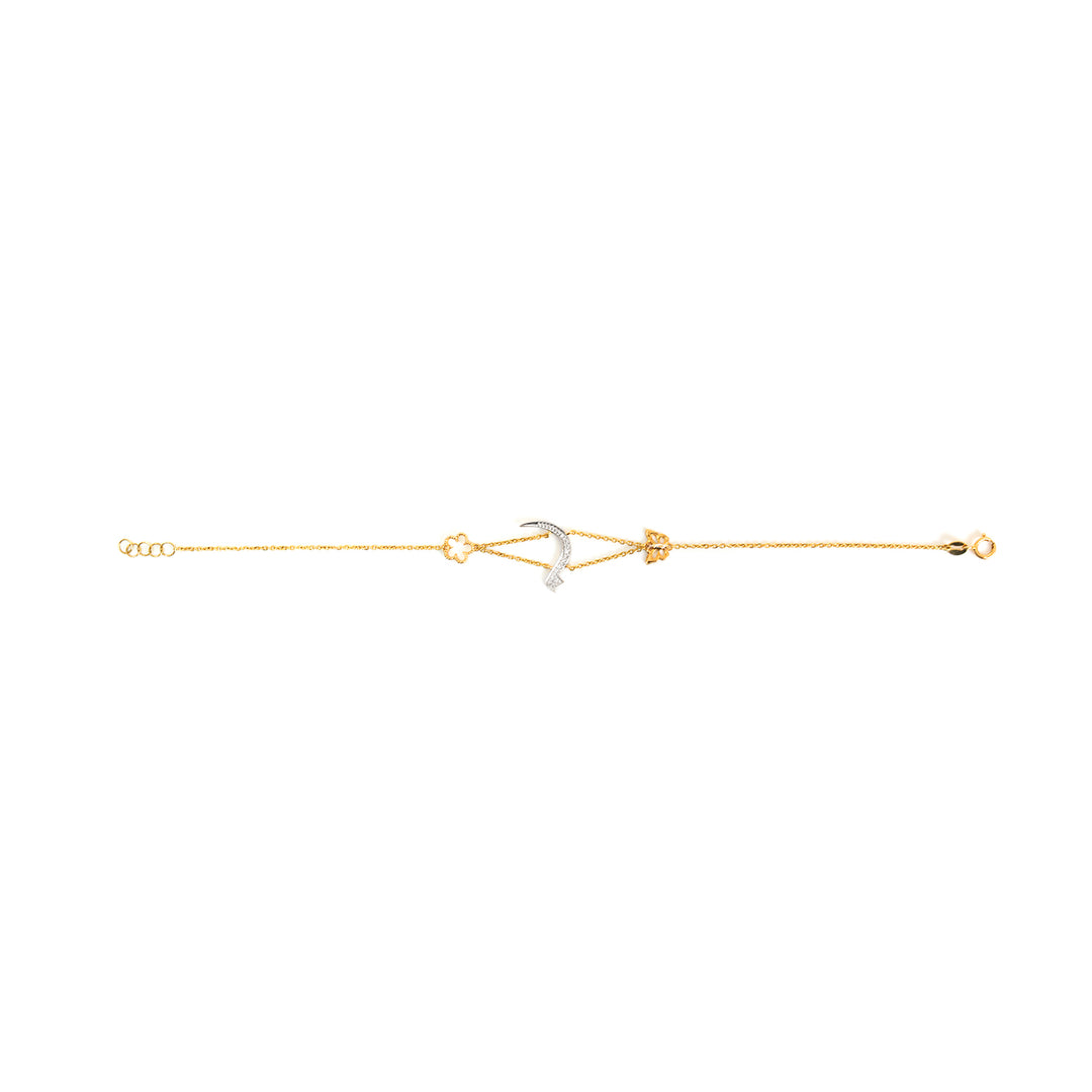 Gold bracelet with a small heart charm on a white background