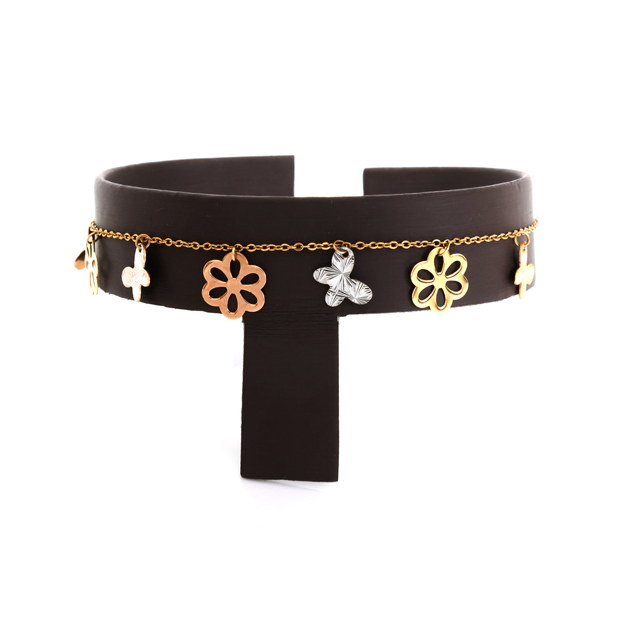 Black leather choker with gold and silver floral charms on a white background