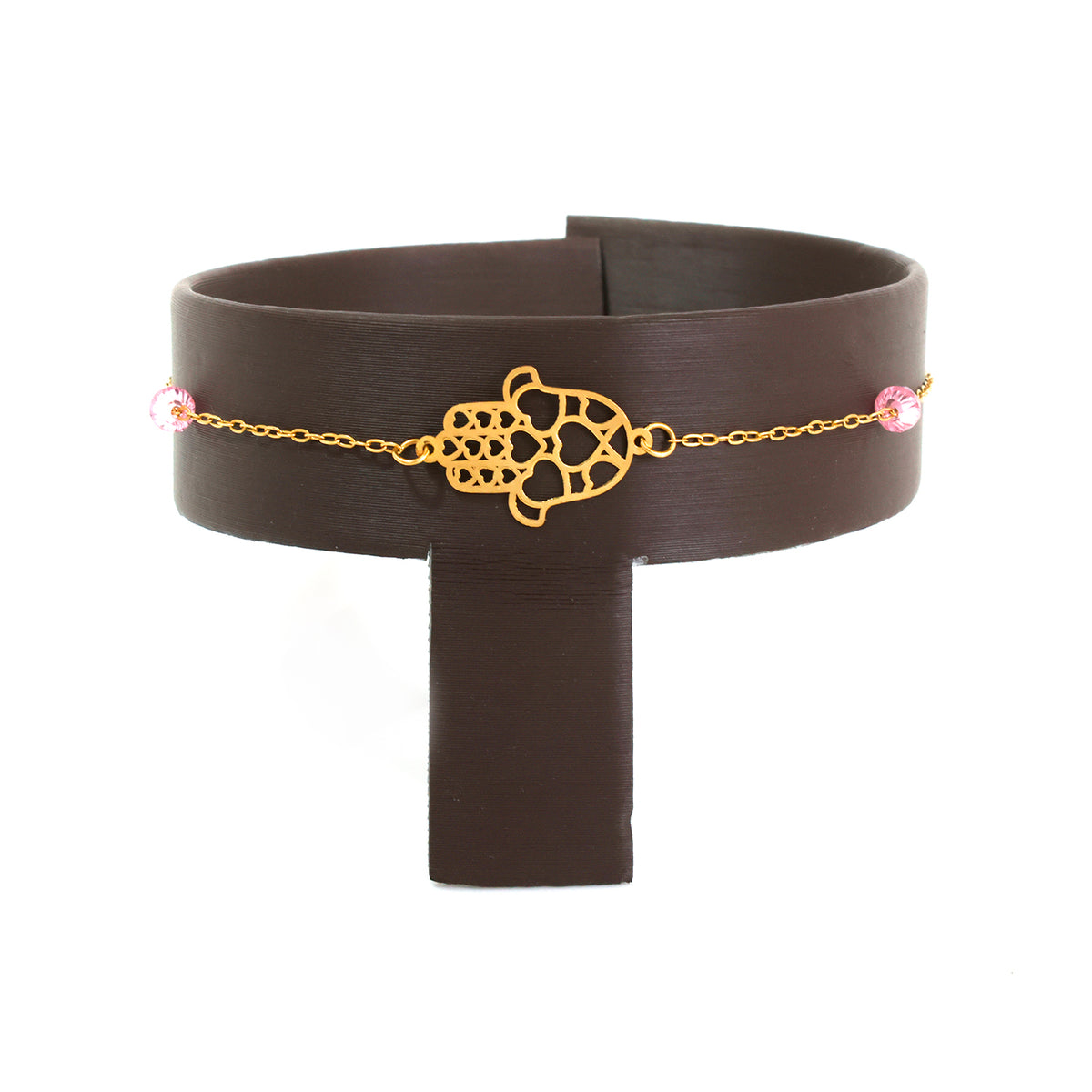 Brown belt with gold chain and pink stones on a white background