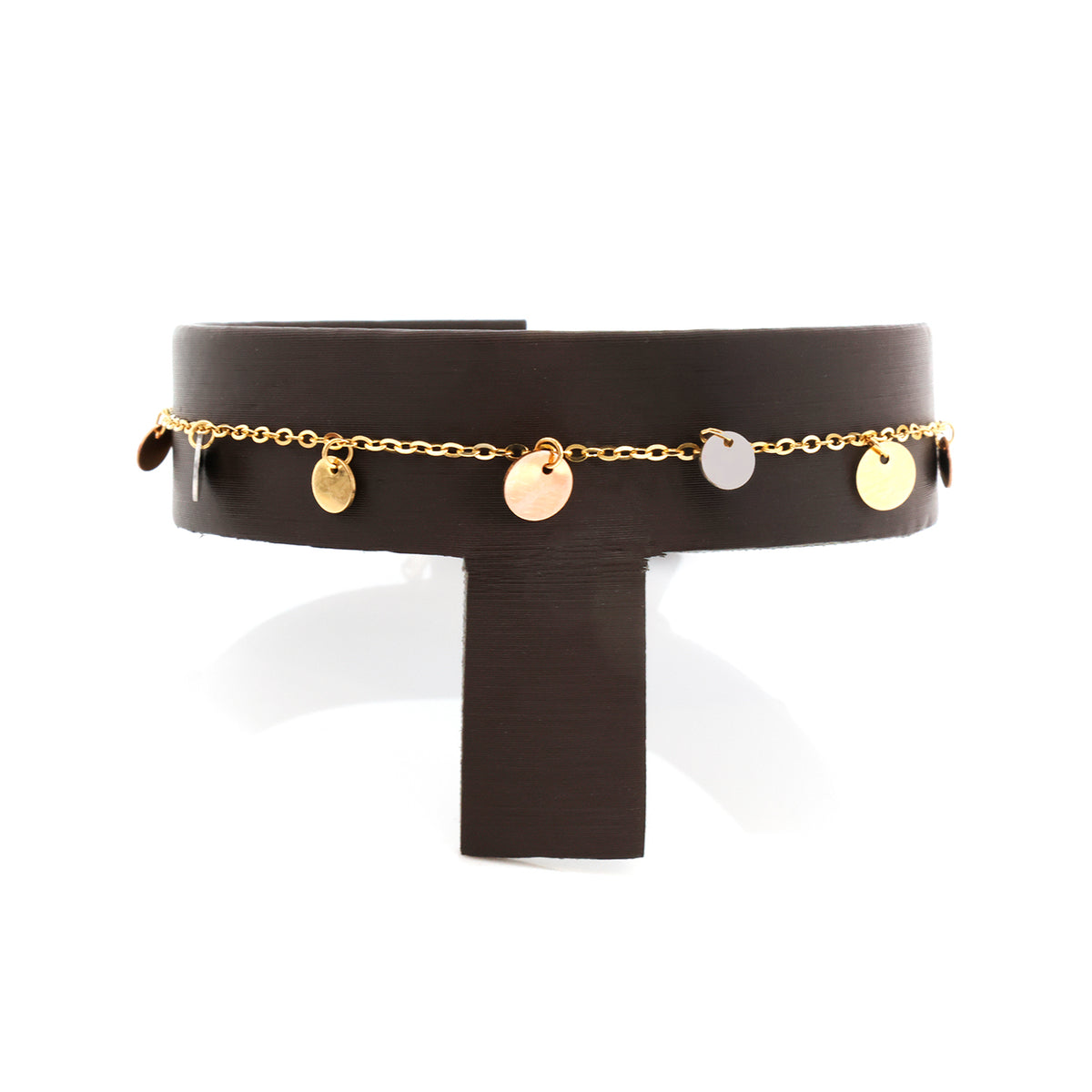 Black belt with gold chain and round embellishments on a white background
