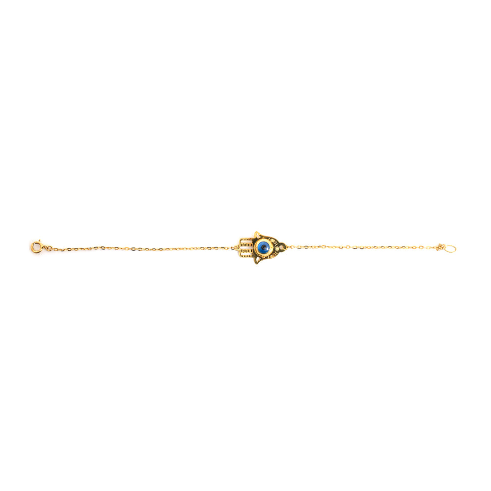 Gold bracelet with a blue gemstone on a white background