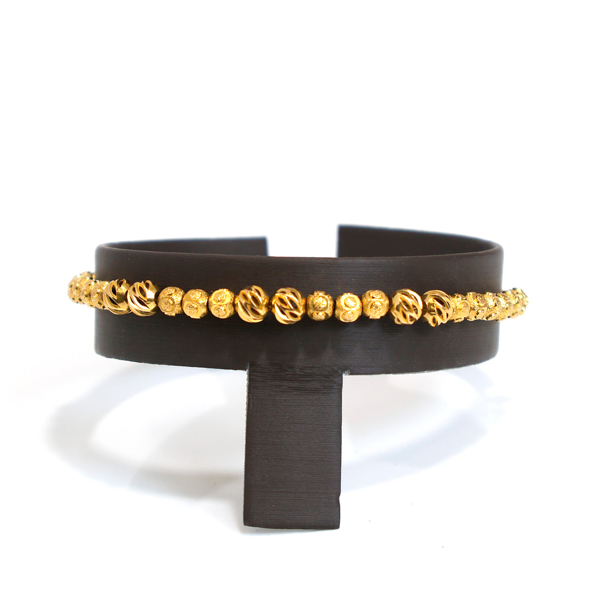 Black belt with gold decorative elements on a white background