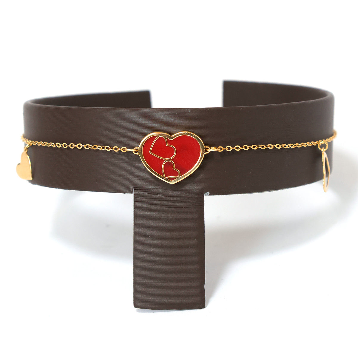 Black leather belt with a red heart-shaped buckle on a white background
