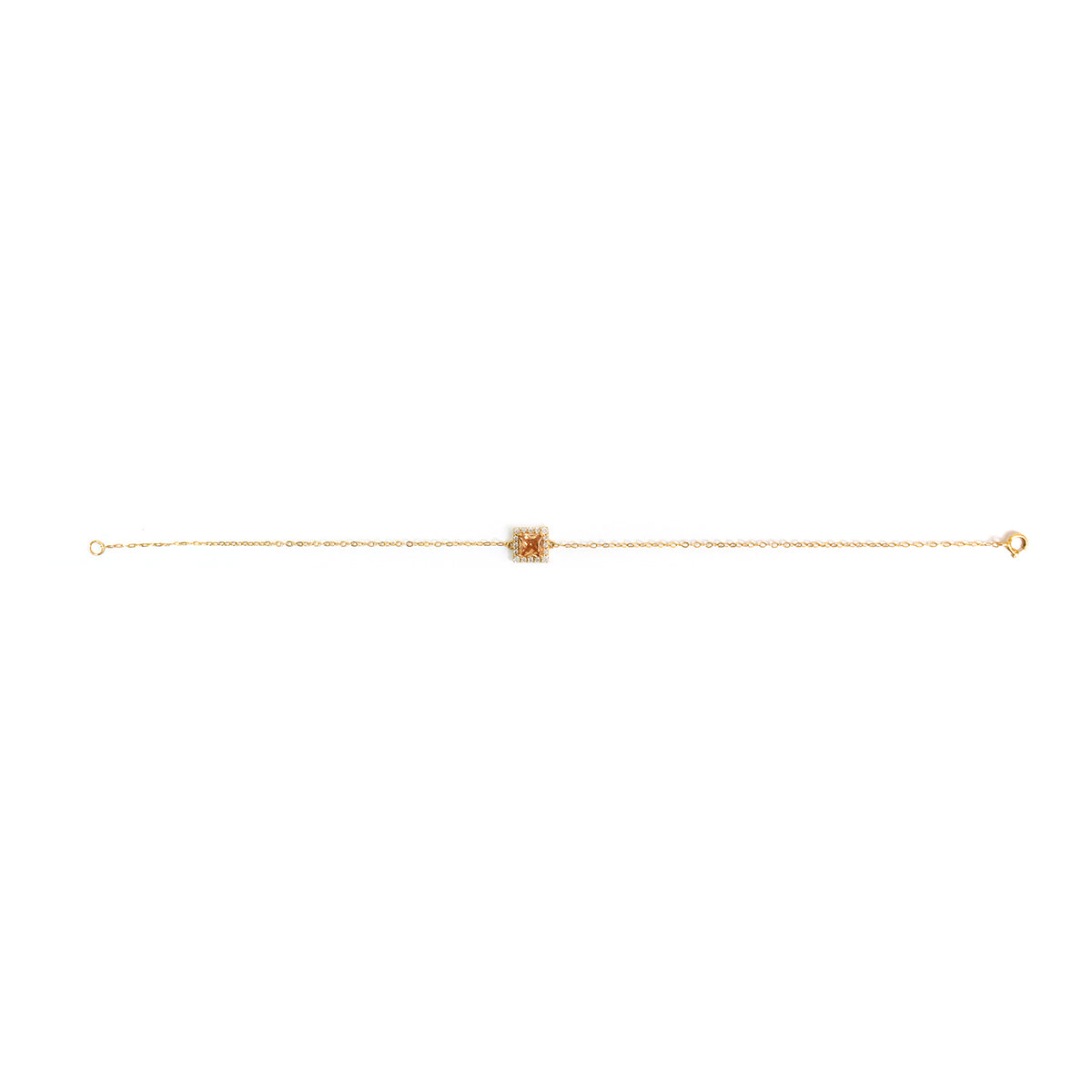 Gold anklet on a white background