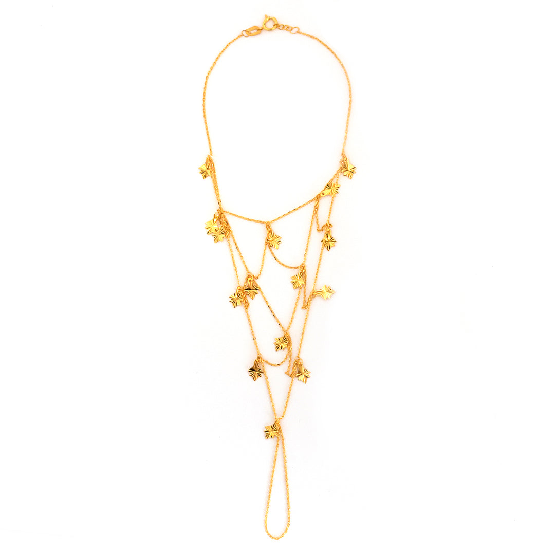 Gold necklace with floral designs on a white background