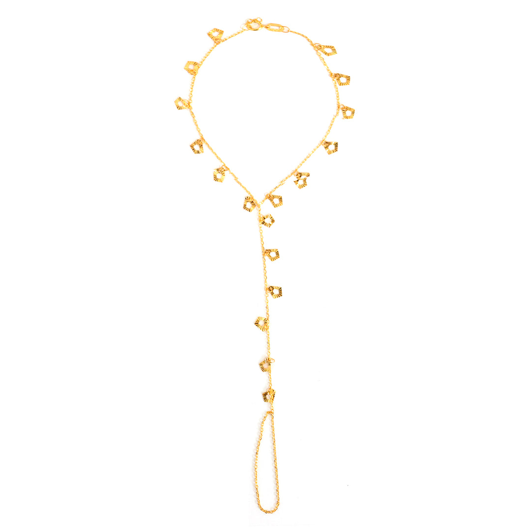 Gold lariat necklace on a white background