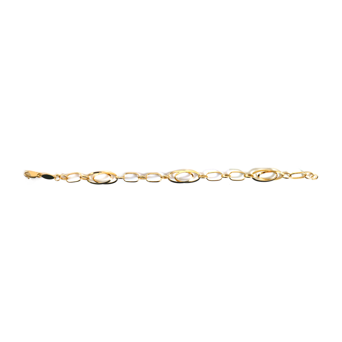 Decorative gold brooch on a white background