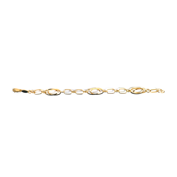 Decorative gold brooch on a white background