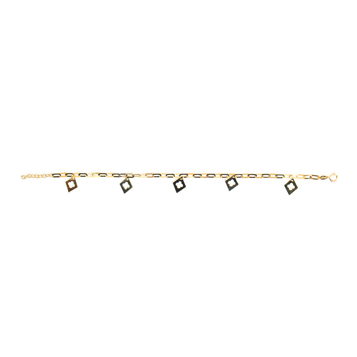 A delicate gold chain bracelet featuring five small square charms, each with a black center, displayed horizontally against a plain white background.