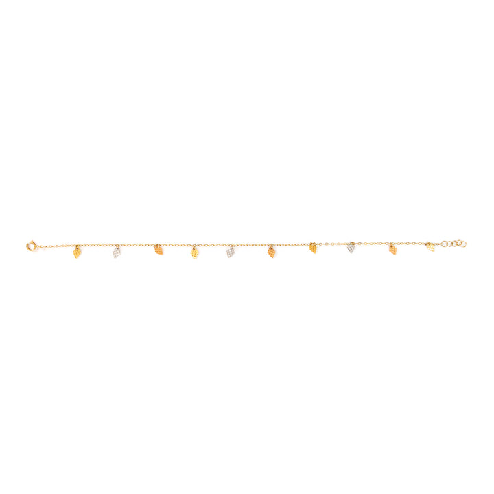 A delicate gold chain bracelet featuring small, irregular gold leaf charms and a few tiny clear stone accents, displayed horizontally against a solid white background.