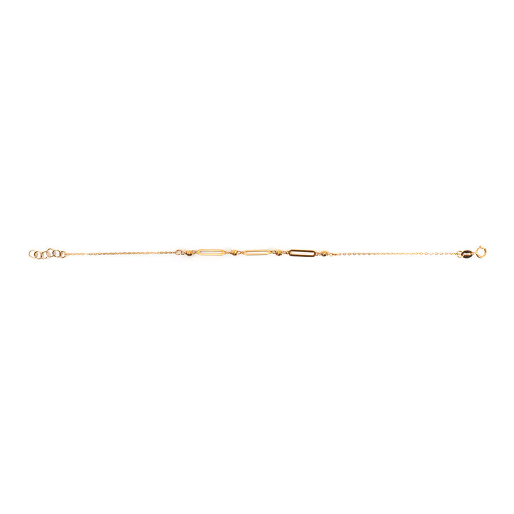 A delicate gold chain bracelet featuring a central bar link motif and small oval accents, displayed horizontally against a plain white background.