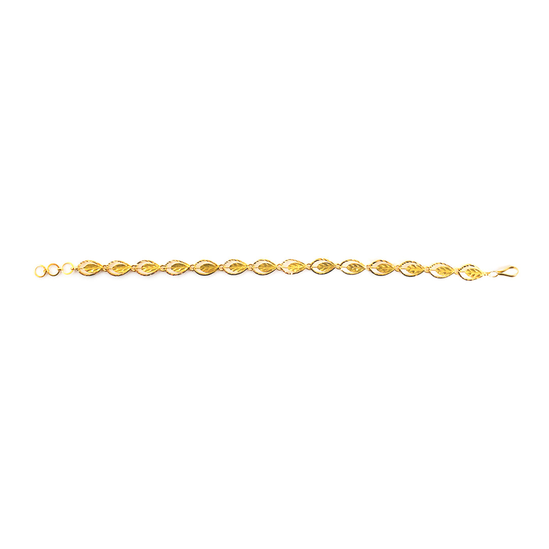 A delicate yellow gold chain bracelet with repeating oval links, displayed horizontally on a plain white background.