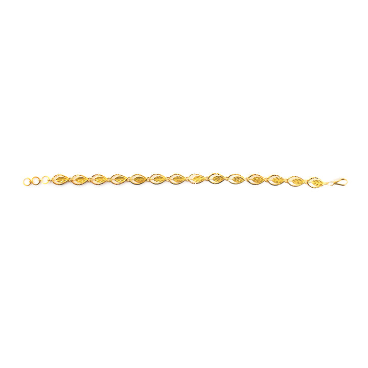 A delicate yellow gold chain bracelet with repeating oval links, displayed horizontally on a plain white background.