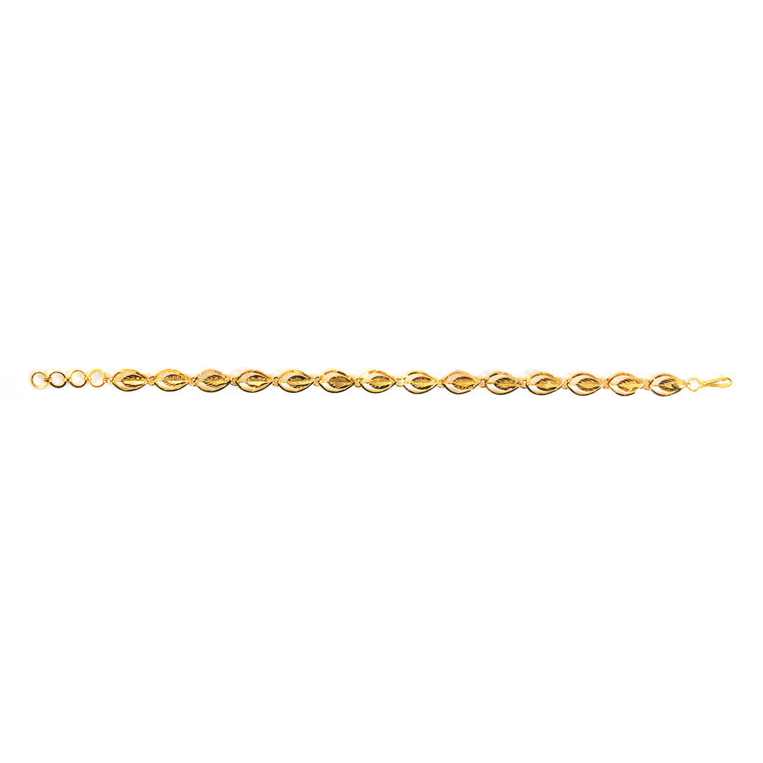 A delicate yellow gold chain bracelet with a repeating twisted oval link pattern, shown horizontally against a plain white background.