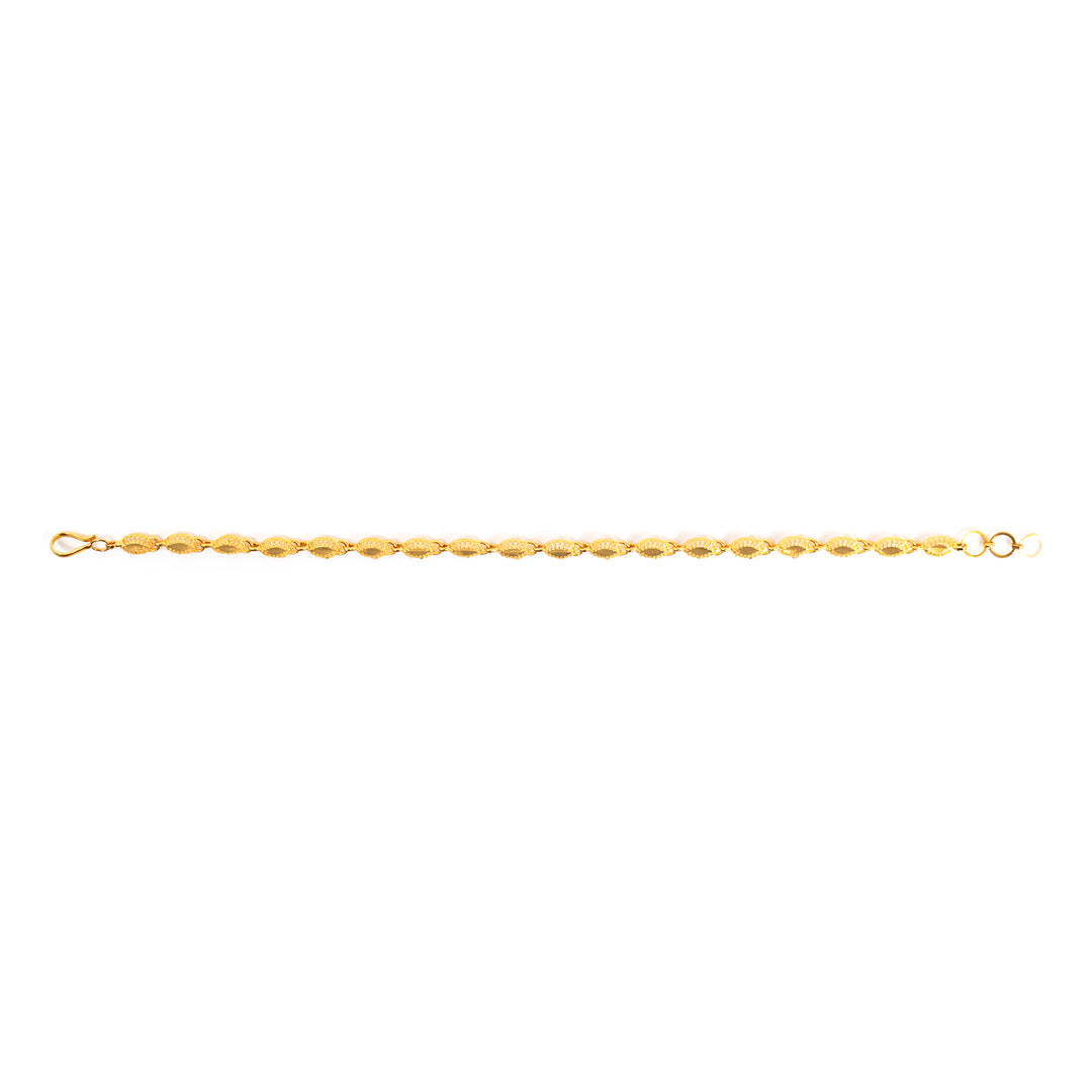 A delicate gold chain bracelet with faceted oval links, shown horizontally against a plain white background.