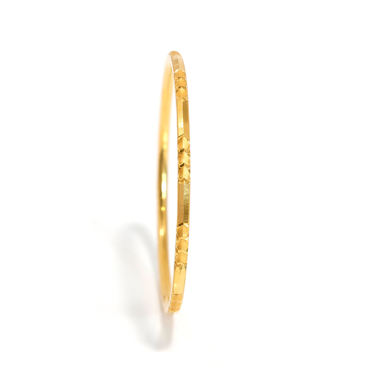 21K Slim Gold Bangle with Faceted Carved Details and Polished Finish - Main View