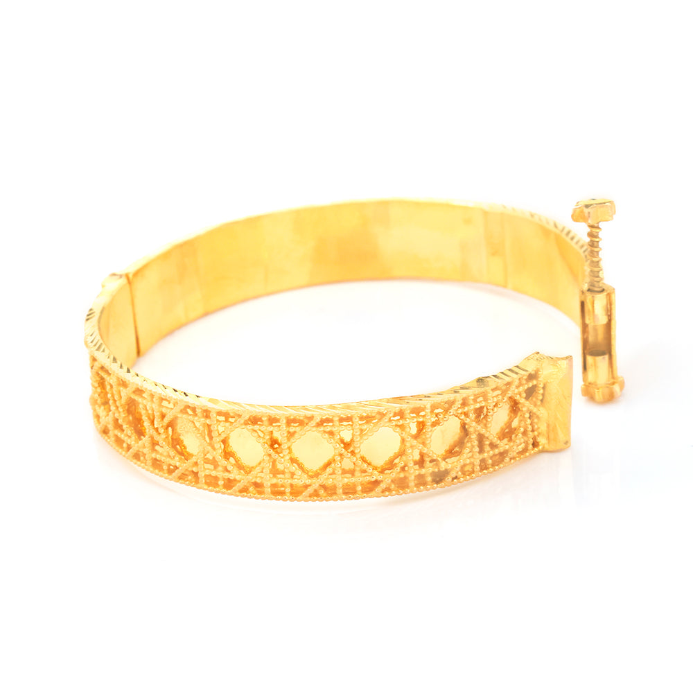 A gold-plated filigree bangle bracelet with a screw clasp, shown on a plain white background.