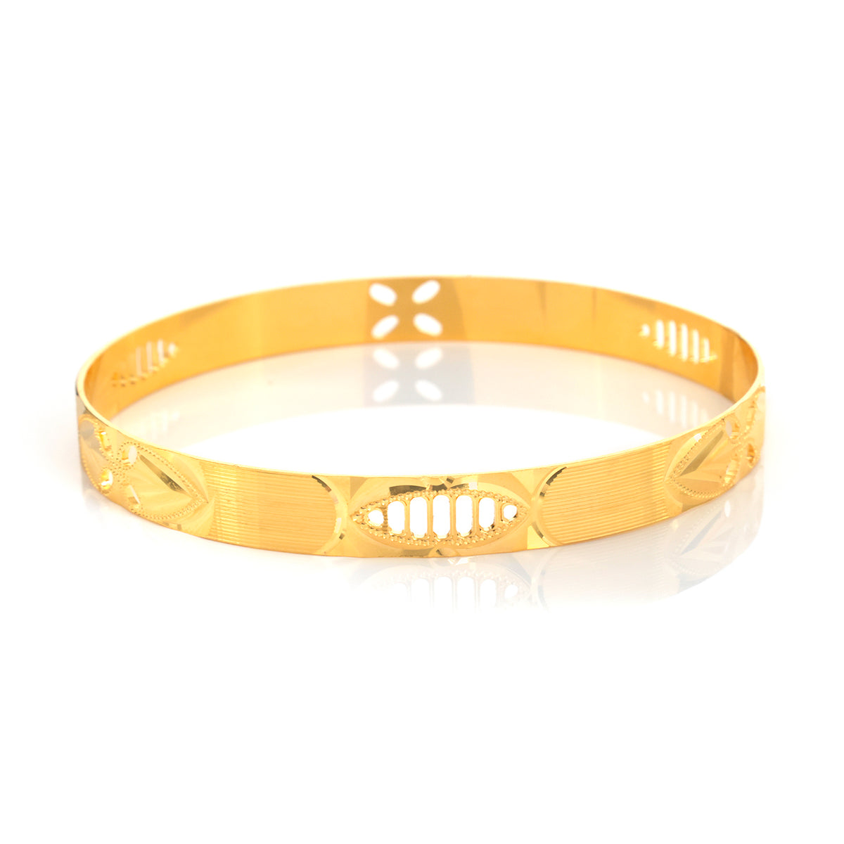 A polished gold-plated bangle bracelet with engraved geometric and leaf-like patterns, displayed on a clean white reflective surface.