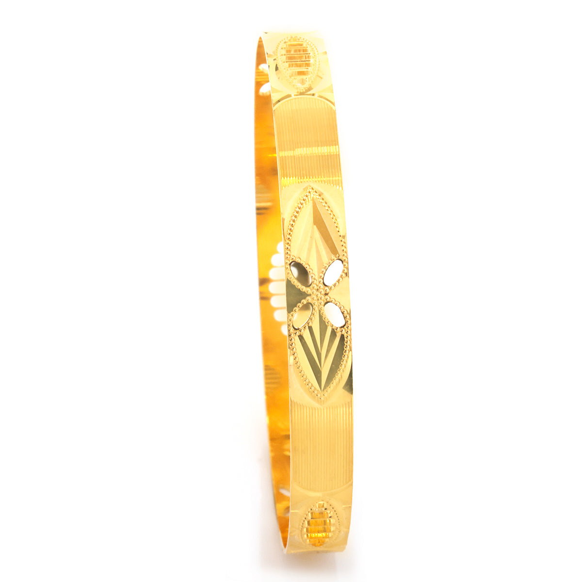 A gold-plated bangle bracelet featuring a central floral filigree design with cutouts and textured details, shown on a plain white background.