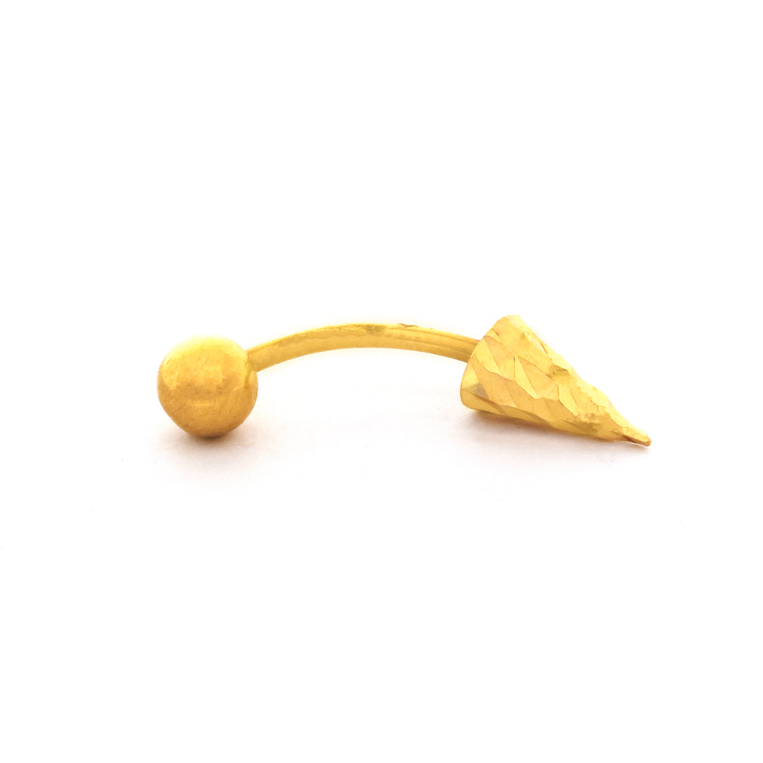 Gold nose ring with a spherical ball and pointed end on a white background