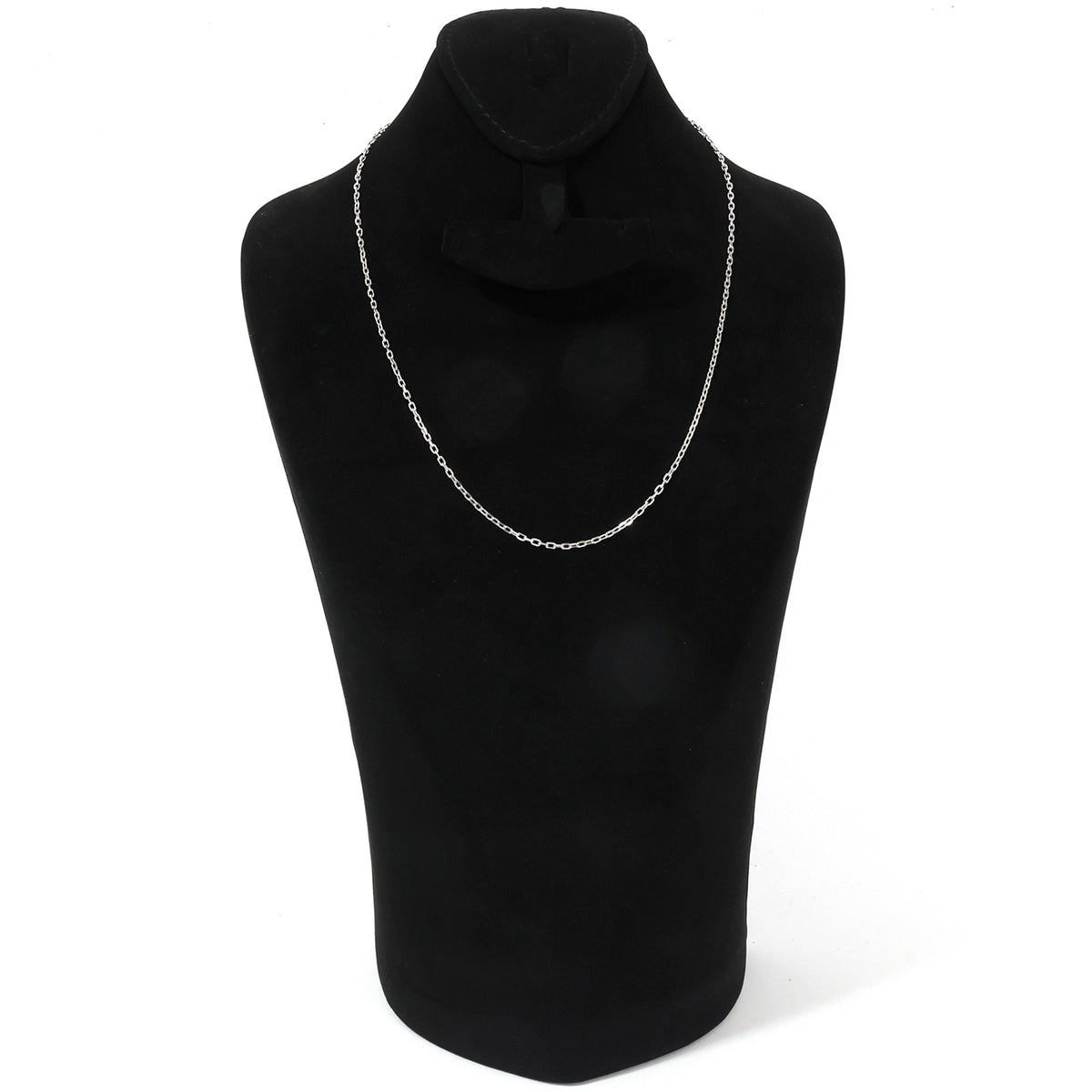 Black turtleneck sweater on a mannequin with a gold necklace against a white background