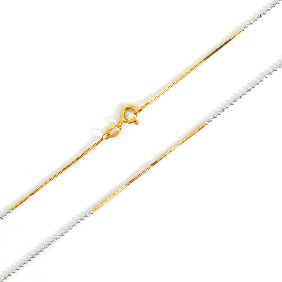 Gold chain necklace on a white background