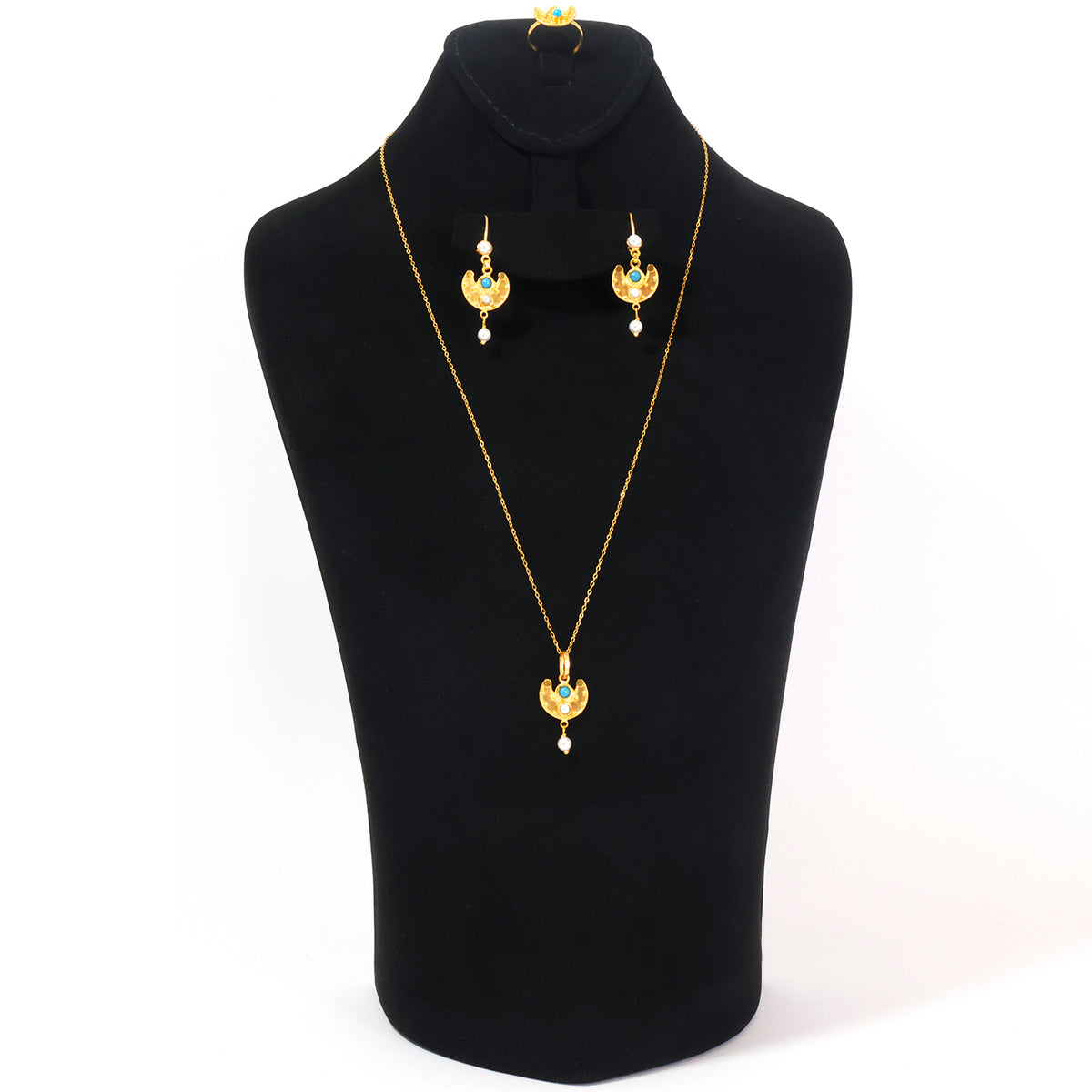 Gold jewelry set featuring a necklace and matching earrings displayed on a black mannequin bust against a white background.